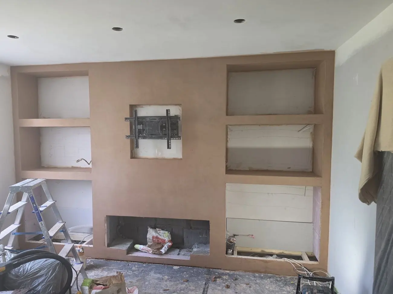 Media wall built and freshly plastered, ready for finishing